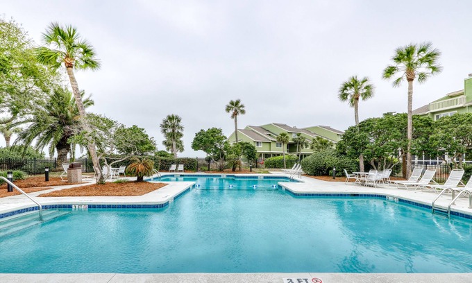 Isle of Palms Villa | Three-story ocean-view villa with pool, balcony, charcoal grill, & central AC