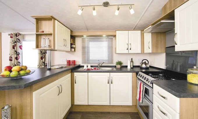 Burnham-on-Sea House | Top of the range 12ft-wide caravan with one double and two twin.