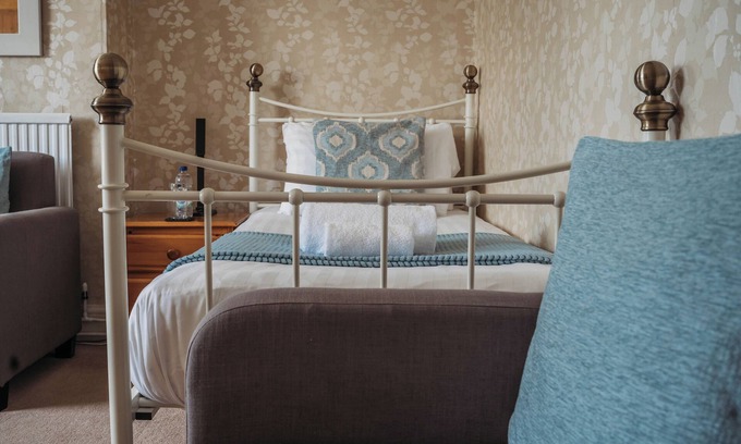 Howey House | Tranquil countryside retreat with stunning views, gardens, and private lake.