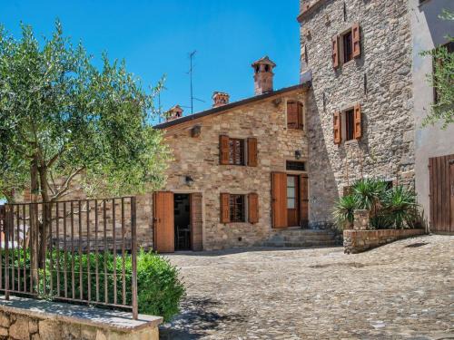 Ca' de' Grimaldi House | Tranquil Village Stay with Fireplace