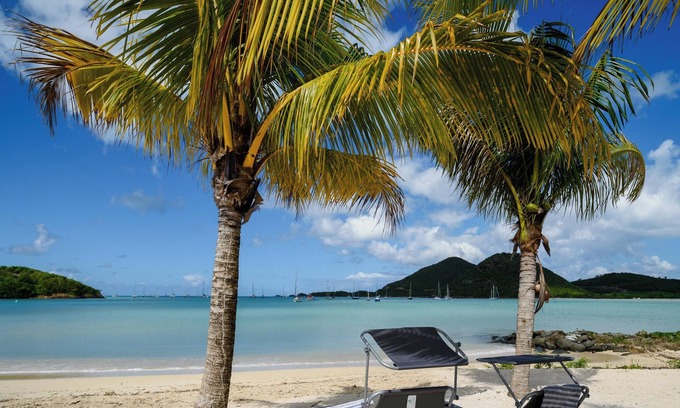 Jolly Harbour Villa | Tranquil Waterfront Villa ~ steps from the Beach, with bikes and terrace views