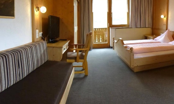 Obsteig Bed & Breakfast | Triple room "Holzleiten" with south and west-facing balcony - Pension Alpenhof -