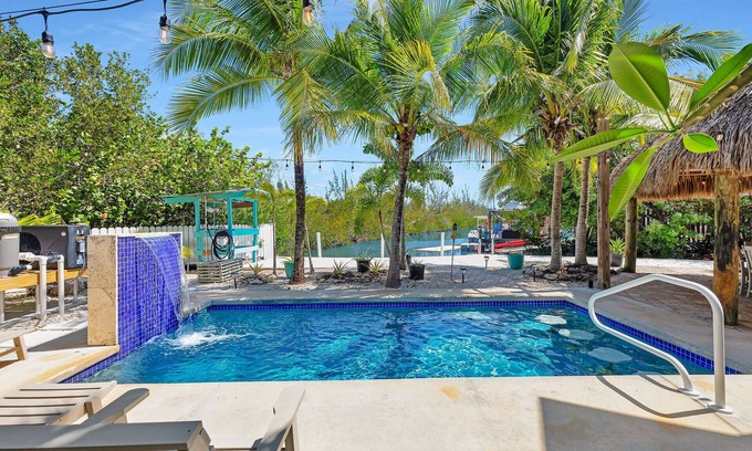Sugarloaf Key House | Tropical paradise on canal in Lower Keys-pool, tiki, firepit, dock, dog friendly