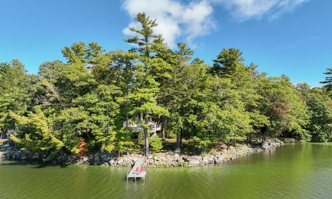 South China House | Two-story lakefront home with a seasonal dock, furnished deck, & washer/dryer