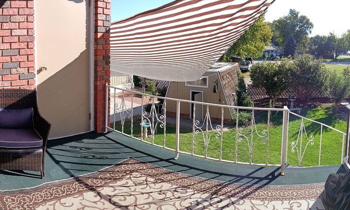 Holdrege Apartment | Uniquely comfy 2nd story, private entrance, outdoor balcony, fence, off street