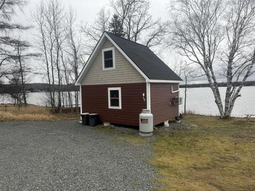 Portage Lake House | Magnificent Cabin Nestled Amidst Trees in Portage Lake, Maine
