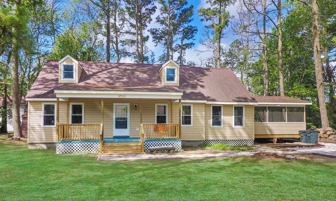 Chincoteague House | Utter East - great home with large screened porch and firepit next to the pond
