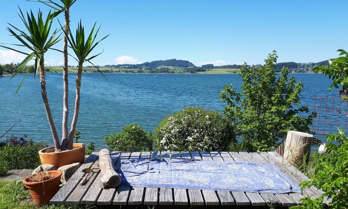 Gross Condo | Vacation dream directly on Lake Sihl with its own beach