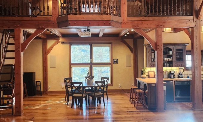 Sundance Cabin | Vaulted beam ceilings, a huge rock fireplace, stream nearby, large campfire area