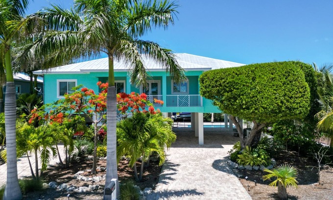 Breezeswept Beach Estates House | Villa Lucie | Canalfront home w/5 bedrooms + pool + boat lift