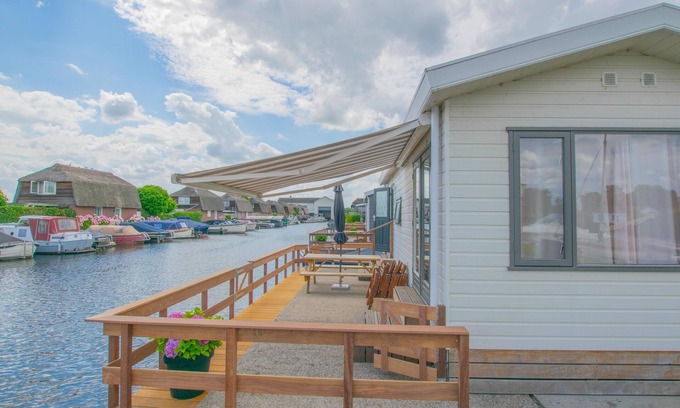 Municipality of Stichtse Vecht Boat Rental | Waterfront chalet with large veranda