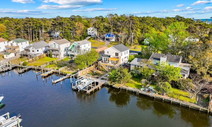 Colington Harbour House | Waterfront home and Oasis with private dock, outdoor bar and firepit