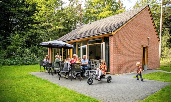 Norg House | When staying in this 12-person bungalow, you don't have a garden, but a whole forest! On the terrace, you can enjoy the outdoors.