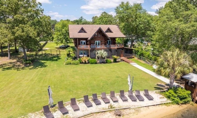 Manning House | Wyboo Lakefront Premier: Log Cabin on the Water!