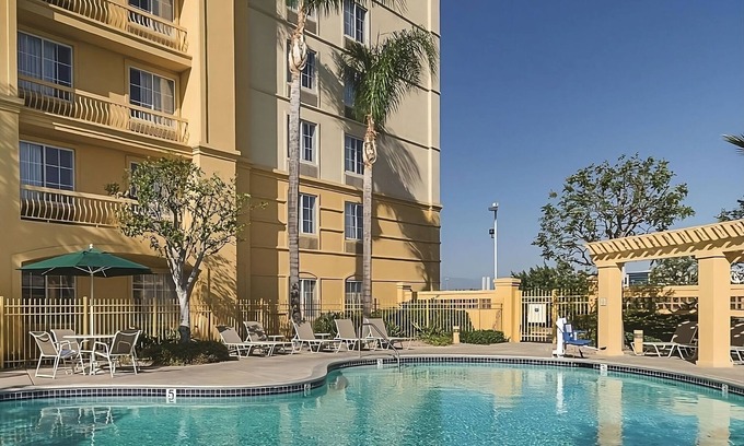 Guasti Hotel | Your Home Away From Home! Amazing unit w/Pool access Near Toyota Arena!