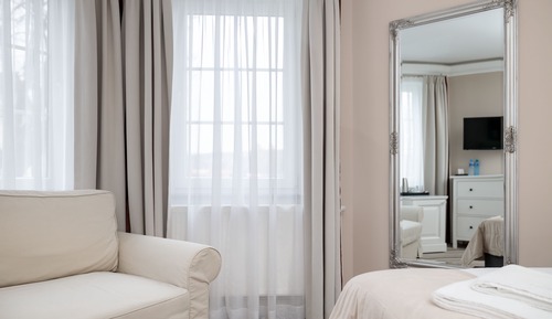 Room with king-size bed and balcony