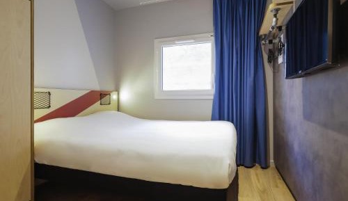 Room with One Queen Bed and an armoire bed