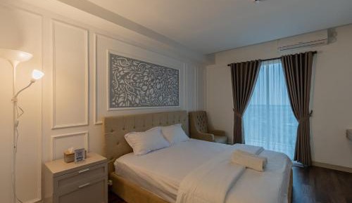 One-Bedroom Apartment with Balcony and City View