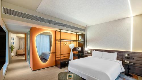 Premier Suite with Complimentary IMFL from 6:00 pm to 8 pm at Barcode and Two Way Airport Transfer