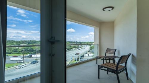 One-Bedroom King Suite with Balcony and City View