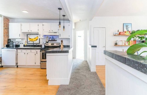 City Park Apartment | Stylish Uptown Retreat - 2BR with Sunroom/Office and Movie Room