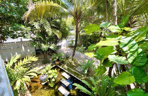 Chang Phueak House | Stay in Style: Cozy AC Room, Tropical Garden & Prime Location.