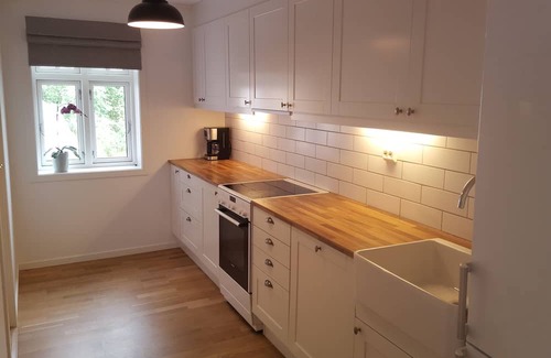 Glomset Apartment | Peaceful countryside flat near Ålesund. Fjord & Mountain views, patio & garden