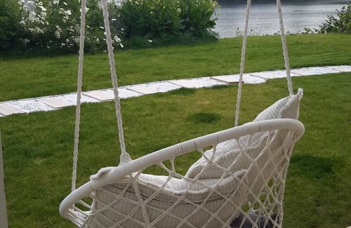 Glomset Apartment | Peaceful countryside flat near Ålesund. Fjord & Mountain views, patio & garden