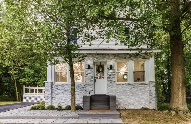 Embrace the charm of our creekside haven featuring 4BR 3BA yoga and BBQ deck.