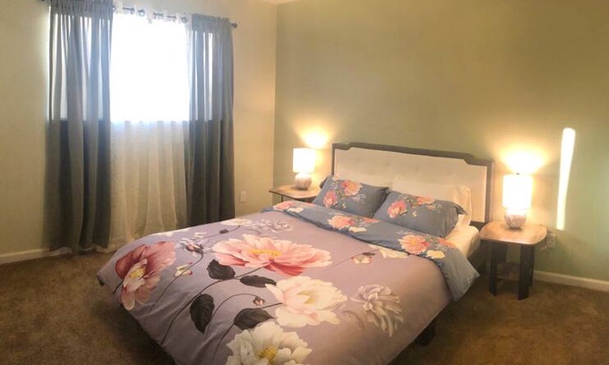 Modesto House | Rosy Bedroom 1 with Private Bathroom
