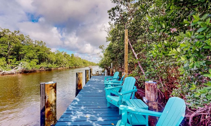 Everglades City House | Colorful riverfront retreat with large patio, pier, & great views - dog-friendly