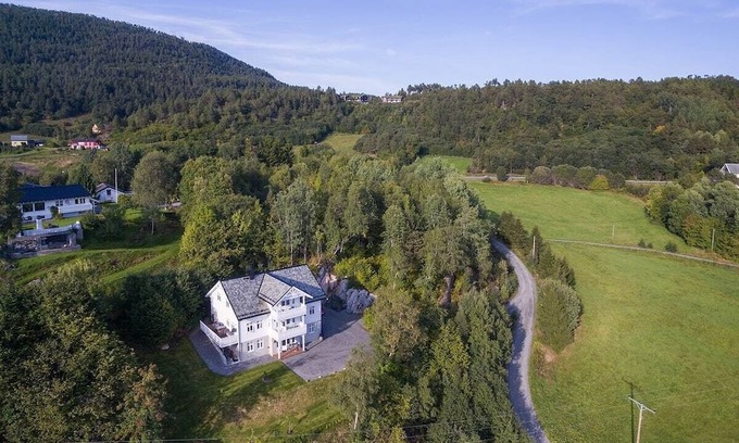 Glomset Apartment | Peaceful countryside flat near Ålesund. Fjord & Mountain views, patio & garden