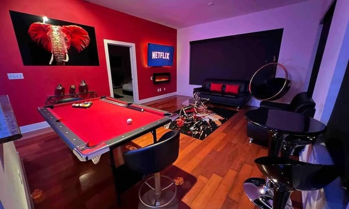 Loring Heights Apartment | The Red Room - Cloud Ceilings - Patio & Bathroom TV